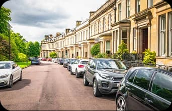 Cars parked on a terraced street